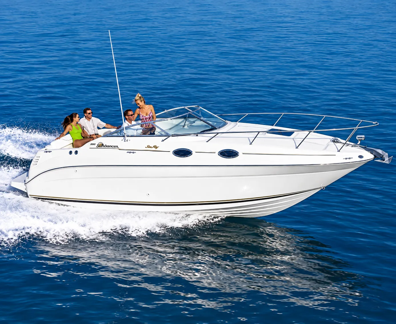 Sea Ray 260 Sundancer express cruiser underway with passengers aboard